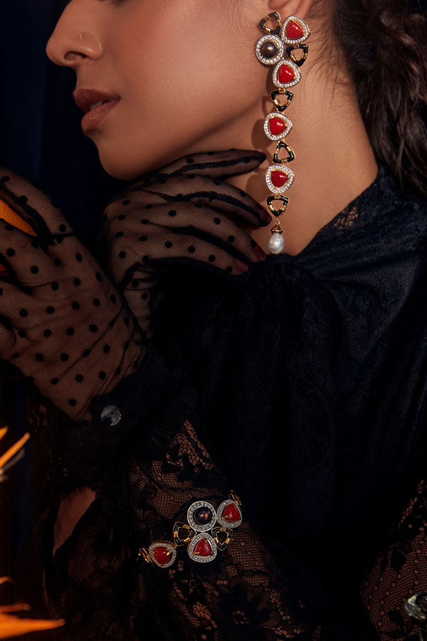 https://cdn.shopify.com/s/files/1/0250/6752/0090/files/cora-long-Earrings_red_janvi-sachdeva.jpg?v=1722313569